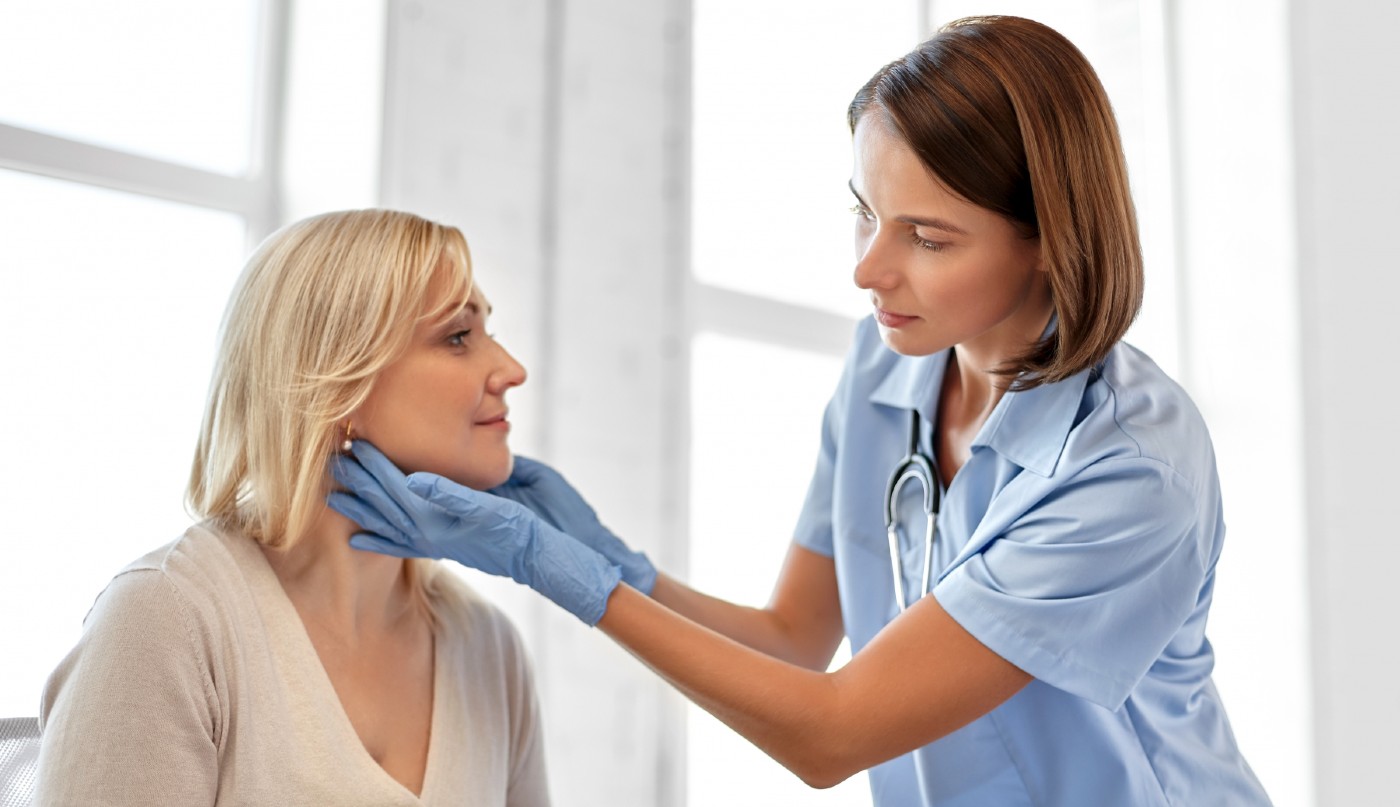 doctor-checking-patient-s-tonsils-at-hospital